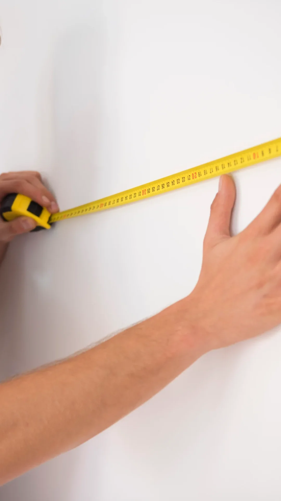 man-taking-measures-future-living-room